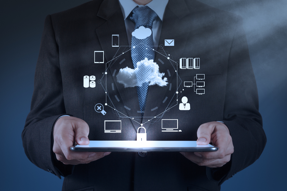 Businessman working with a Cloud Computing diagram on the new co