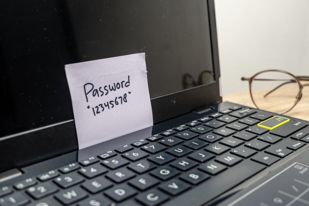 AStickyNoteWithAPasswordWrittenOnItPlaced